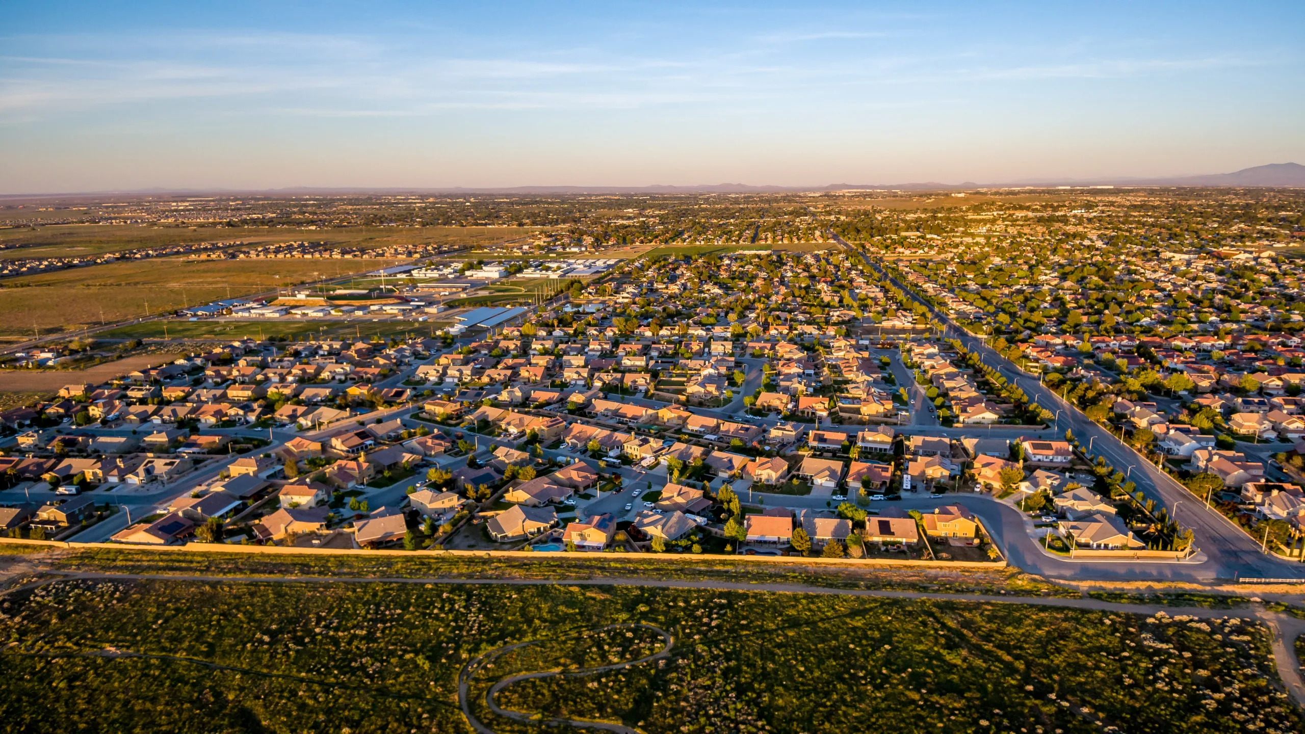 Aerial view of Quartz Hill, California, during golden hour—showcasing a peaceful suburban grid where locals explore wellness options like a Quartz Hill dispensary or search for the best dispensary in Quartz Hill.